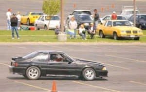 LARRY MAYER/Gazette Staff A driver races through a pylon course in the Skyview High parking lot during the Memorial Day w eekend autocross event. The Yellow stone Region Sports Car Club of America holds local events to hone drivers carhandling skills.